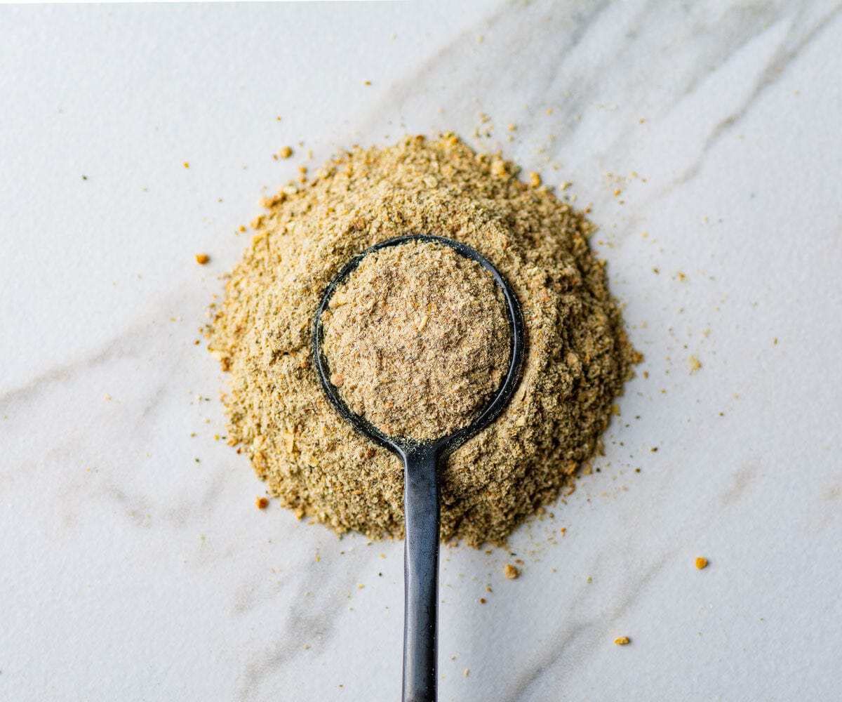 Savory Spice Four Mushroom Umami Blend jar closeup highlights fine powder for quick umami boost.