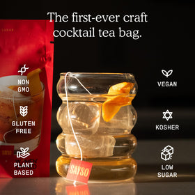 SaySO Old Fashioned tea bag closeup highlights dried fruits and herbs.