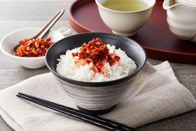 SB Chili Oil with Crunchy Garlic dish plate shot suggests versatile topping for chicken and pasta