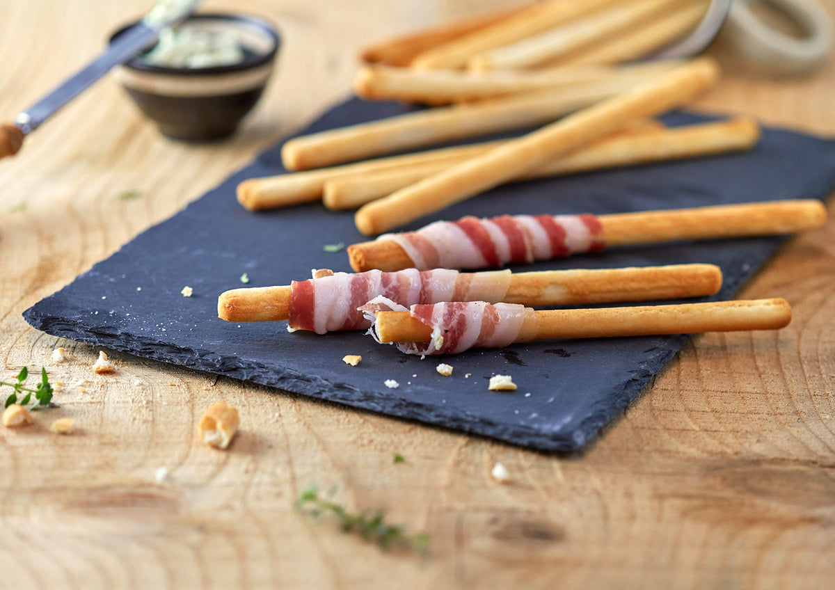Schär gluten-free breadsticks close-up showing crisp texture ideal for dipping.
