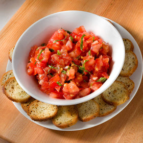 Schwartz Brothers Garlic and Herb Bagel Chips in a bowl ready for sharing.