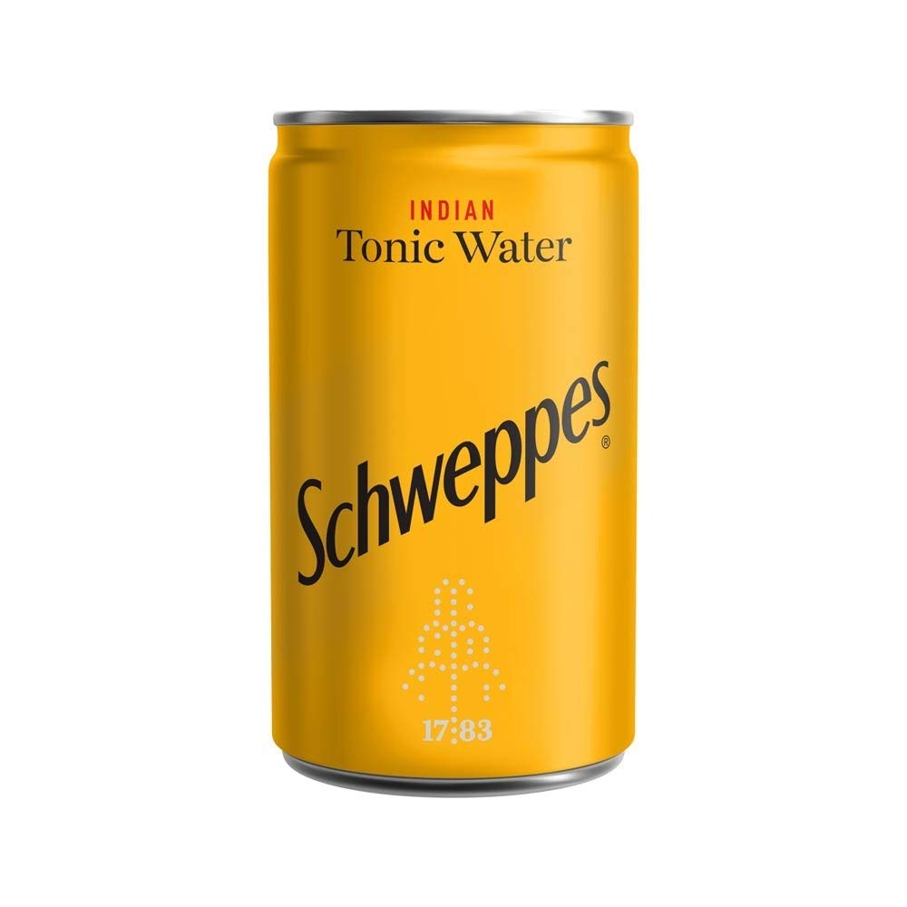 Schweppes Indian Tonic Water with glass and ice ideal mixer for refreshing drinks