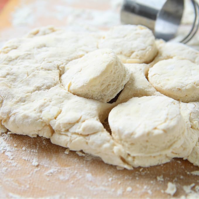 Dough being rolled with Scotty's Everyday mix for fluffy low carb biscuits.