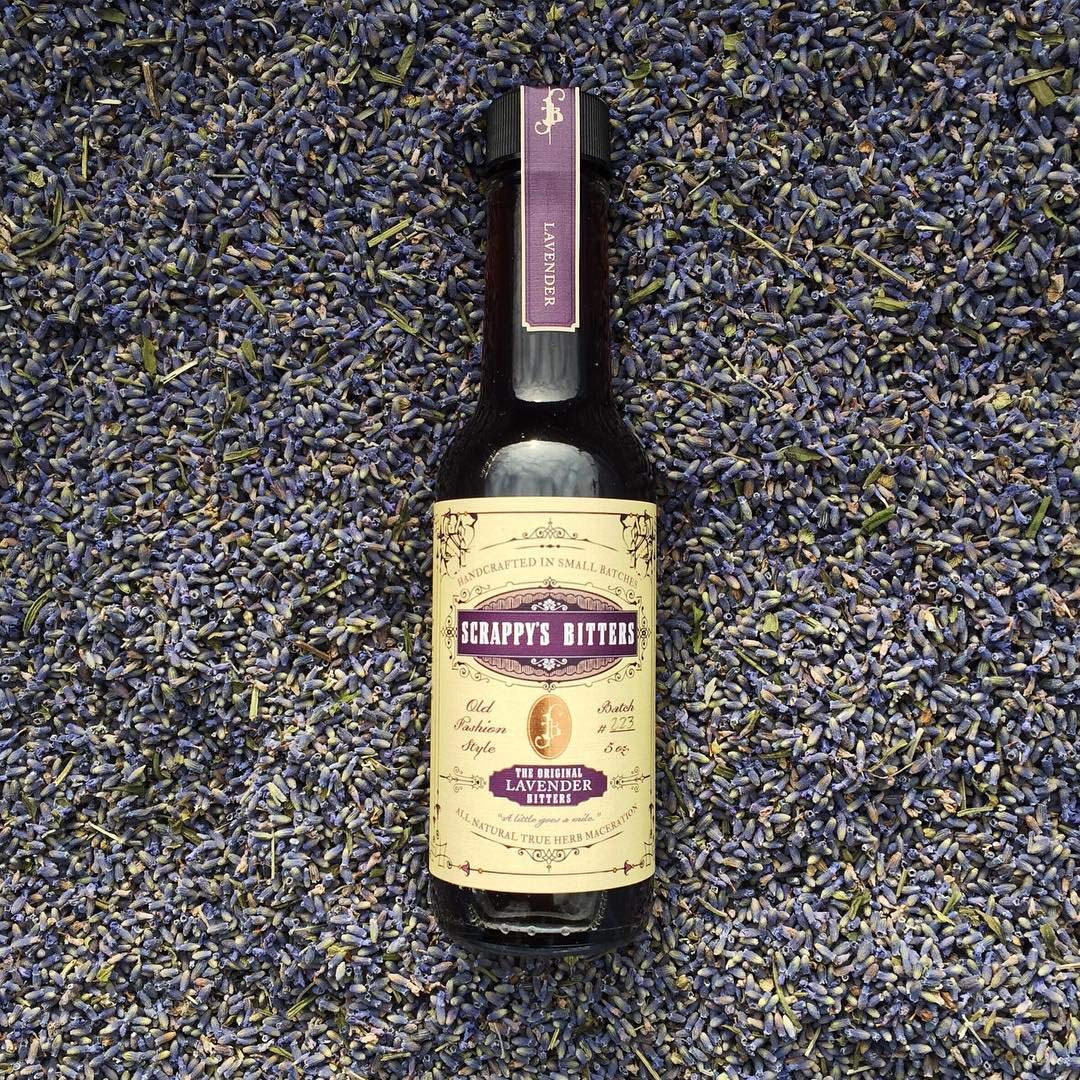 Scrappy's Lavender drops on a glass rim hint at aromatic balance for drinks.