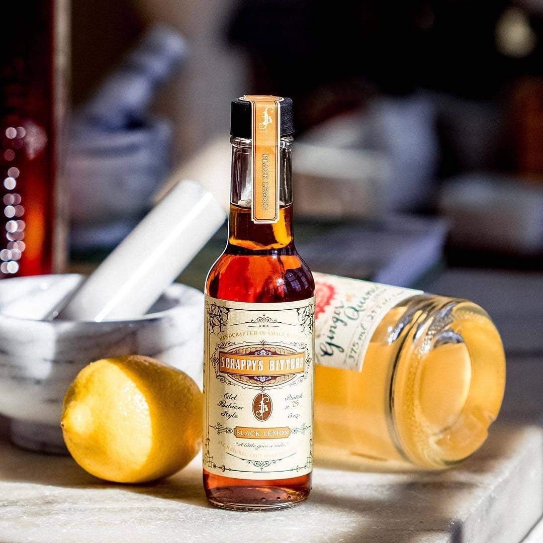 Scrappy's Black Lemon cocktail served to showcase earthy, bright, and floral notes.