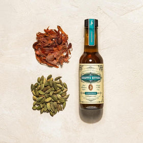 Scrappy's Cardamom Bitters bottle closeup emphasizes natural ingredients and hand-made care.