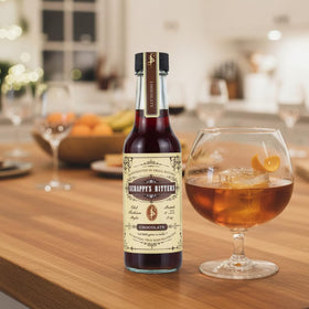 Scrappy's Chocolate Bitters pour shot hints at chocolate-forward cocktails.