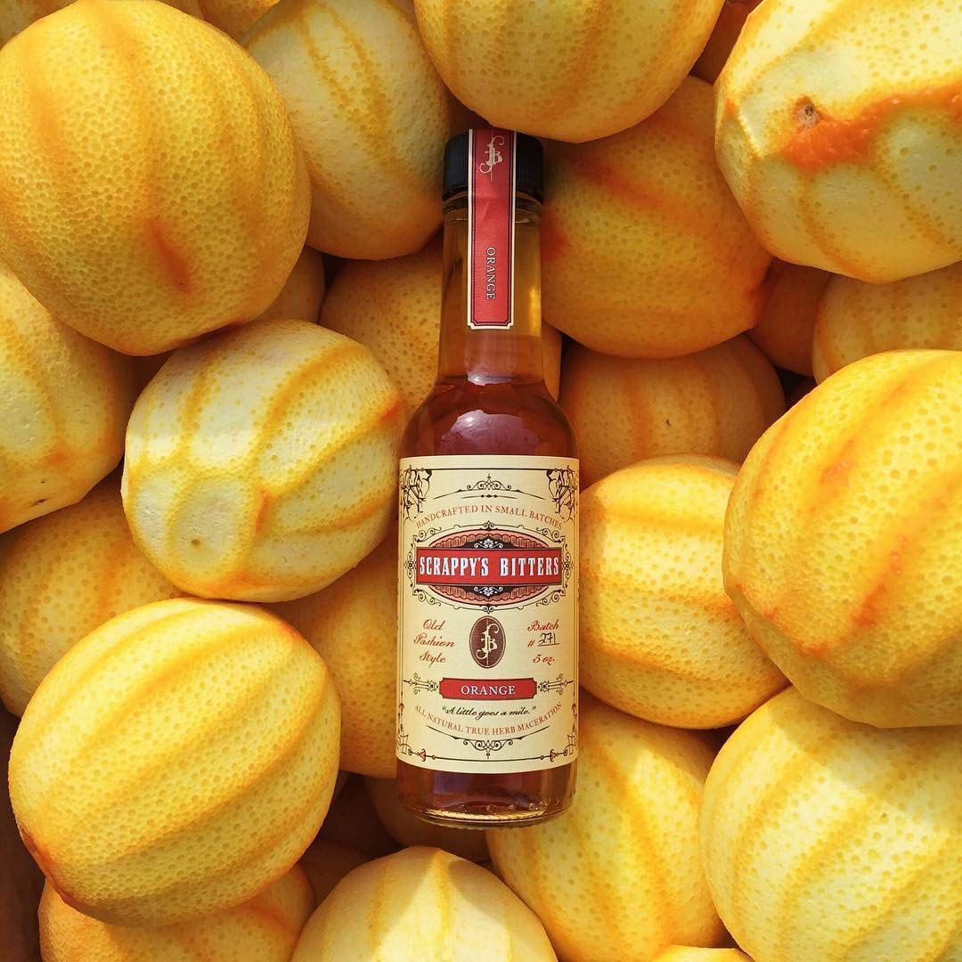 Close-up of Scrappy's Orange Bitters showing bright citrus zest.