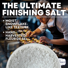 Close-up of Baja Fleur de Sel flakes showing delicate crystals for flavor.