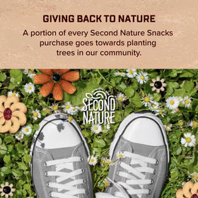 Second Nature trail mix serving in hand demonstrates portable snack ideal for travel.