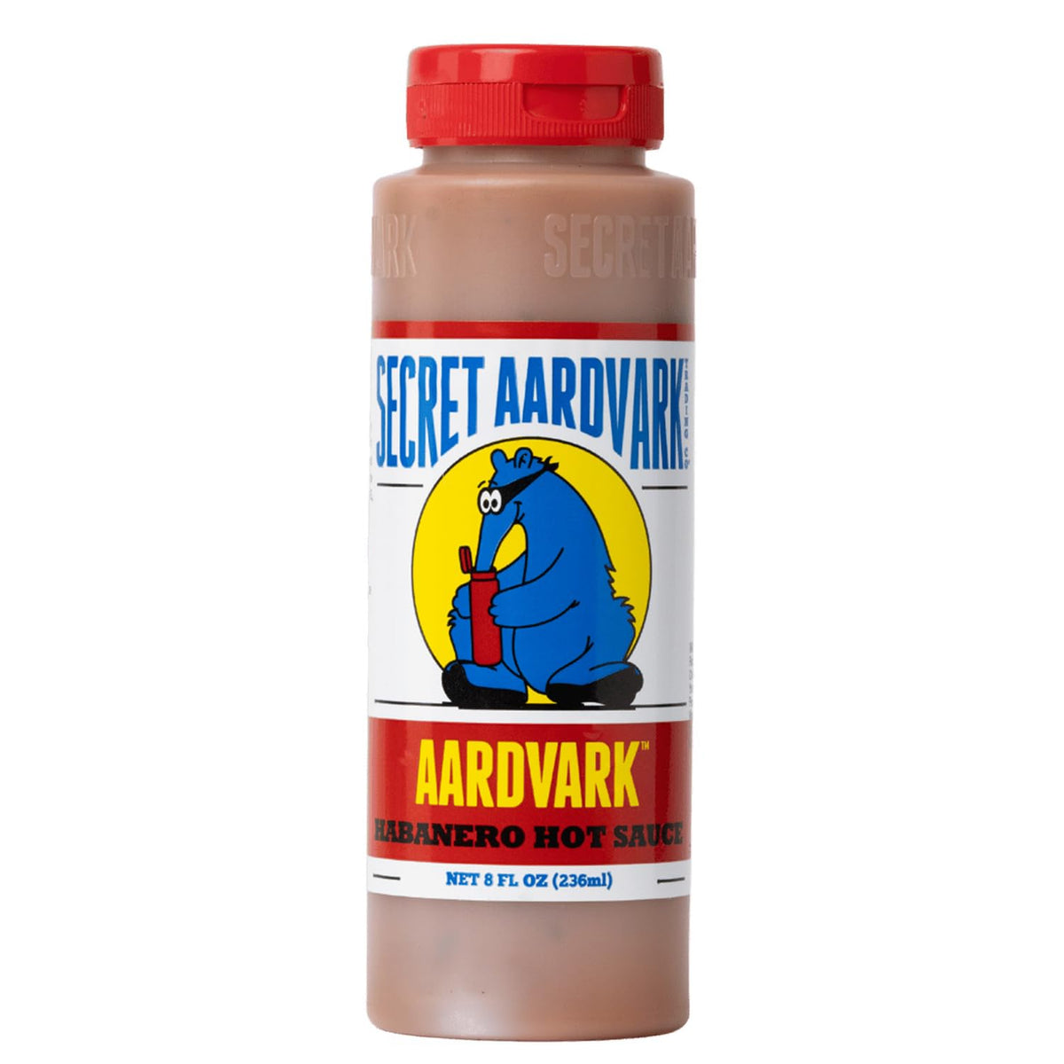 Secret Aardvark habanero hot sauce bottle pour enhances flavor on grilled dishes
