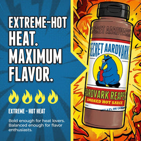 Secret Aardvark Reaper Hot Sauce drizzled over BBQ ribs for bold flavor.