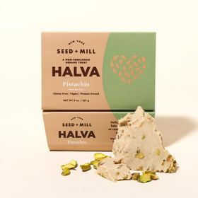 Pistachio halva slices arranged on a plate highlighting flaky texture