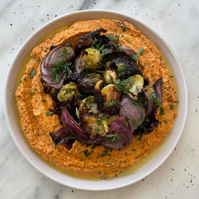 Seed + Mill tahini on pita with vegetables