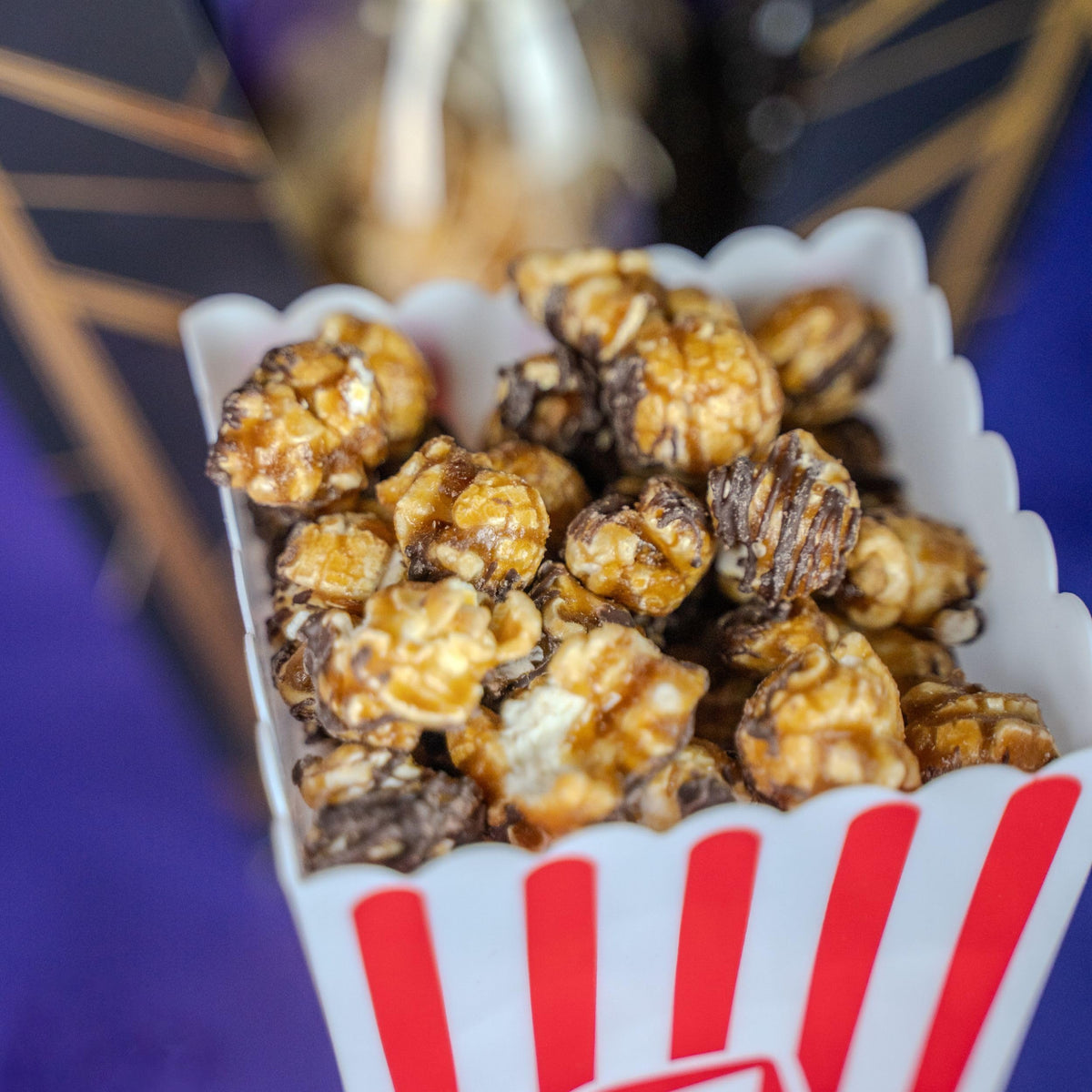 Send A Cake birthday popcorn close-up showcases caramel and chocolate flavors.