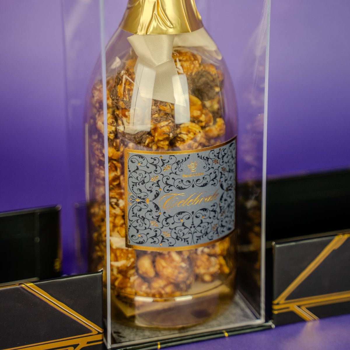 Send A Cake Luxe Box black gold packaging signals elegant birthday gift.
