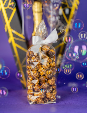 Send A Cake unboxing moment capturing popping bubbles experience.