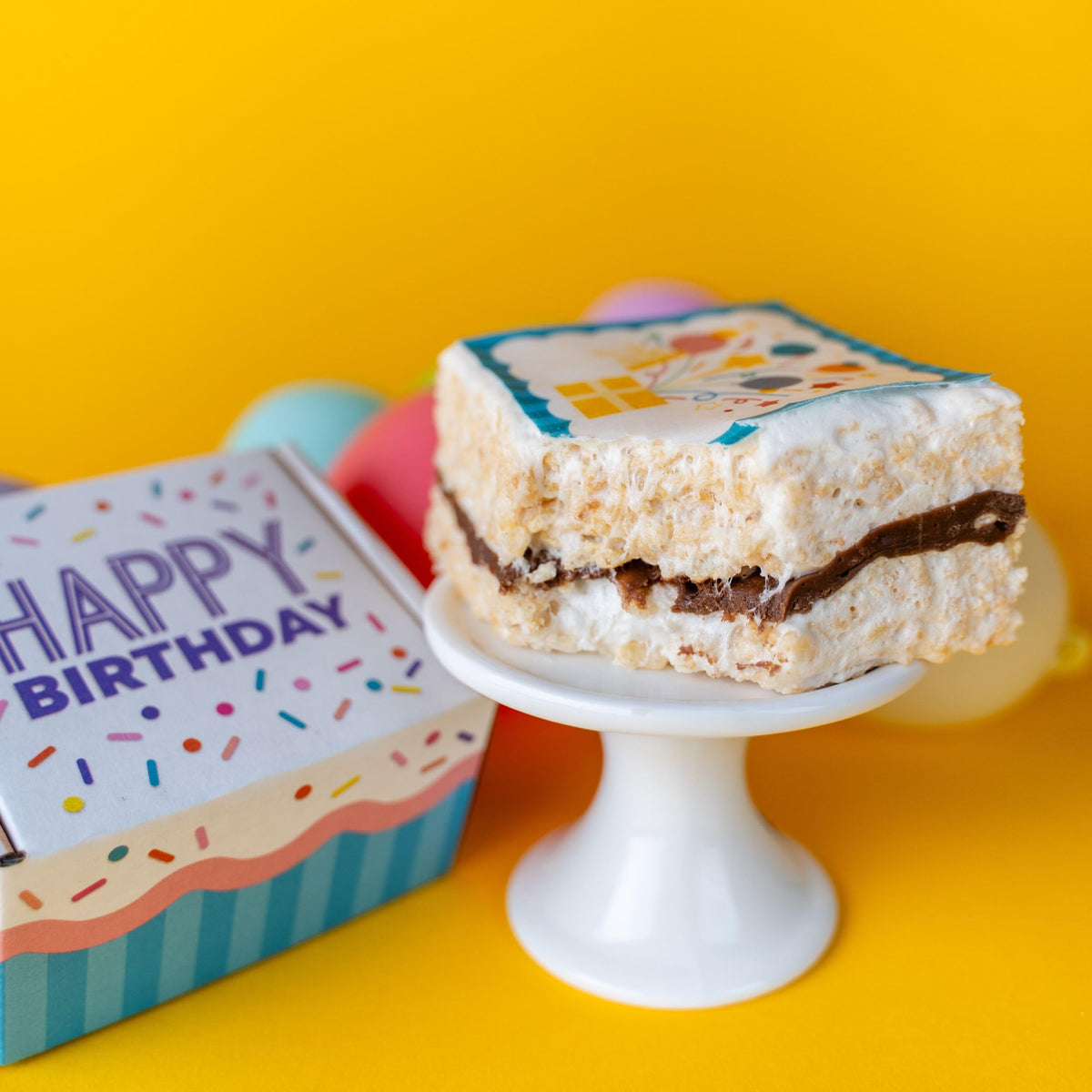 Send A Cake ready-to-gift packaging features festive confetti design.