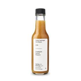 Senor Lechuga hot sauce bottle pour highlighting fruity heat for wings and tacos