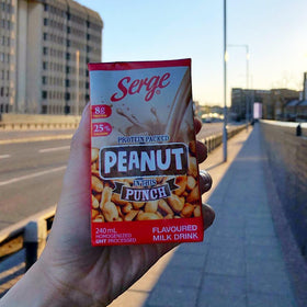 Serge Peanut Punch glass pour showcases creamy texture and convenient ready-to-drink option.