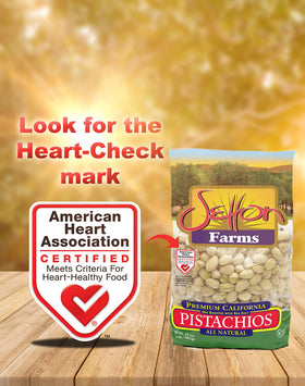 Person holding Setton Farms pistachios for on the go snacking