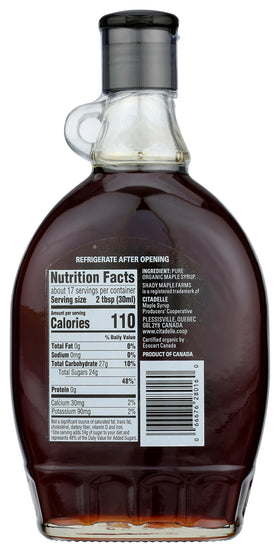 Shady Maple Farm maple syrup pouring glaze over pancakes, adds robust sweetness.