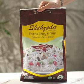 Shahzada Basmati Sela Rice raw grains close-up showing extra long slender grains