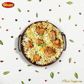 Serving dish ready with fragrant rice and herbs.