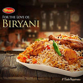 Close-up of Shan Biryani Masala spices and herbs.