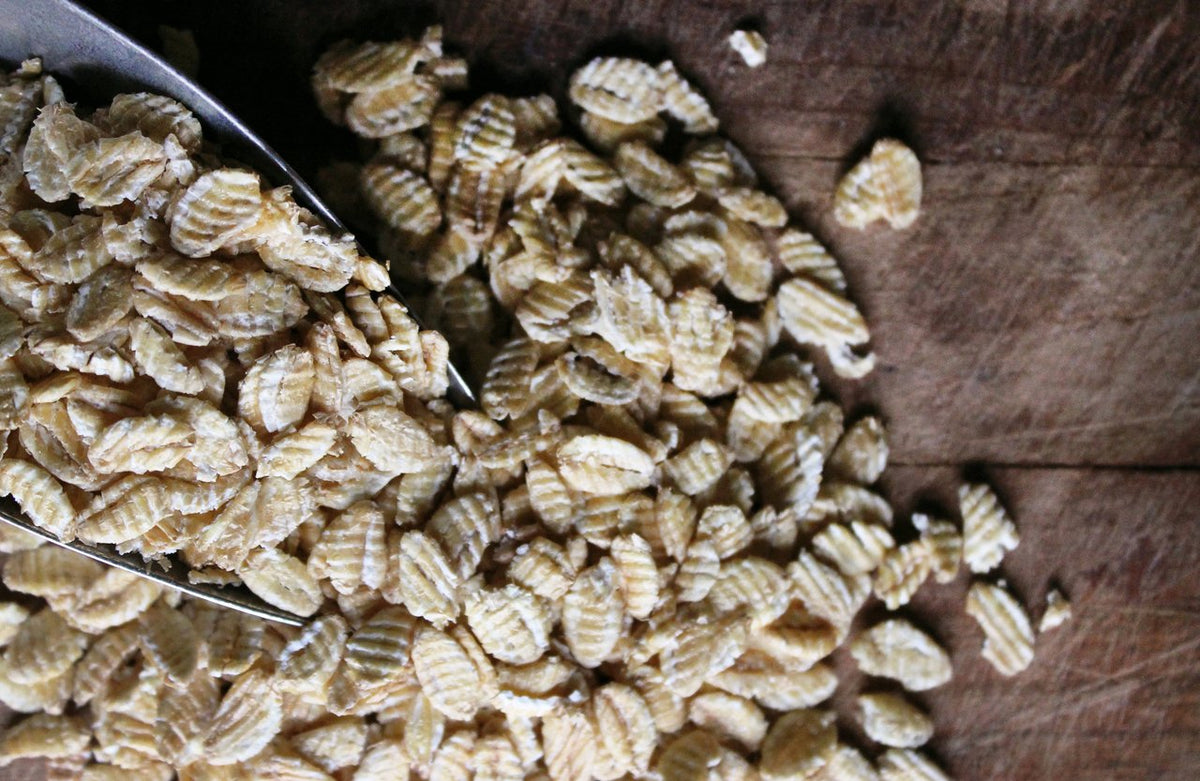 Shiloh Farms Organic Kamut Flakes in a pot, simmering into a warm porridge.