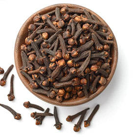 Whole cloves on a spice rack from Organic Spice Resource for kitchen warmth.