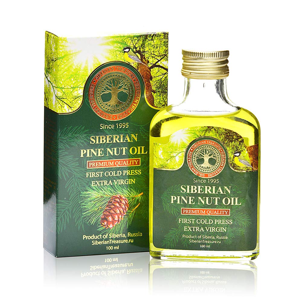 Siberian Treasure pine nut oil bottle on wood, premium oil for culinary use.