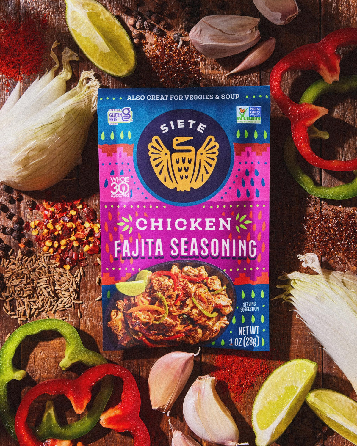 Siete Chicken Fajita Seasoning in pan with peppers and onions.