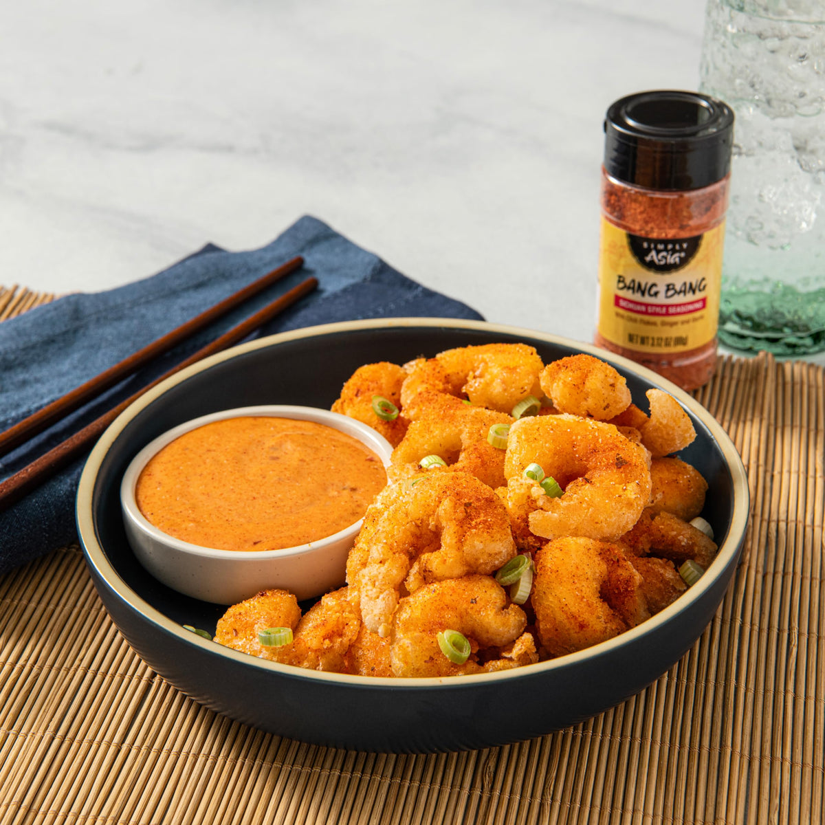 Simply Asia Bang Bang seasoning enhances a shrimp dish with sweet-spicy coating