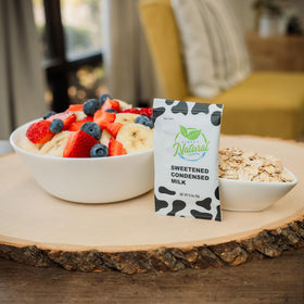 Simply Natural milk flavor creamer shown beside a hot beverage