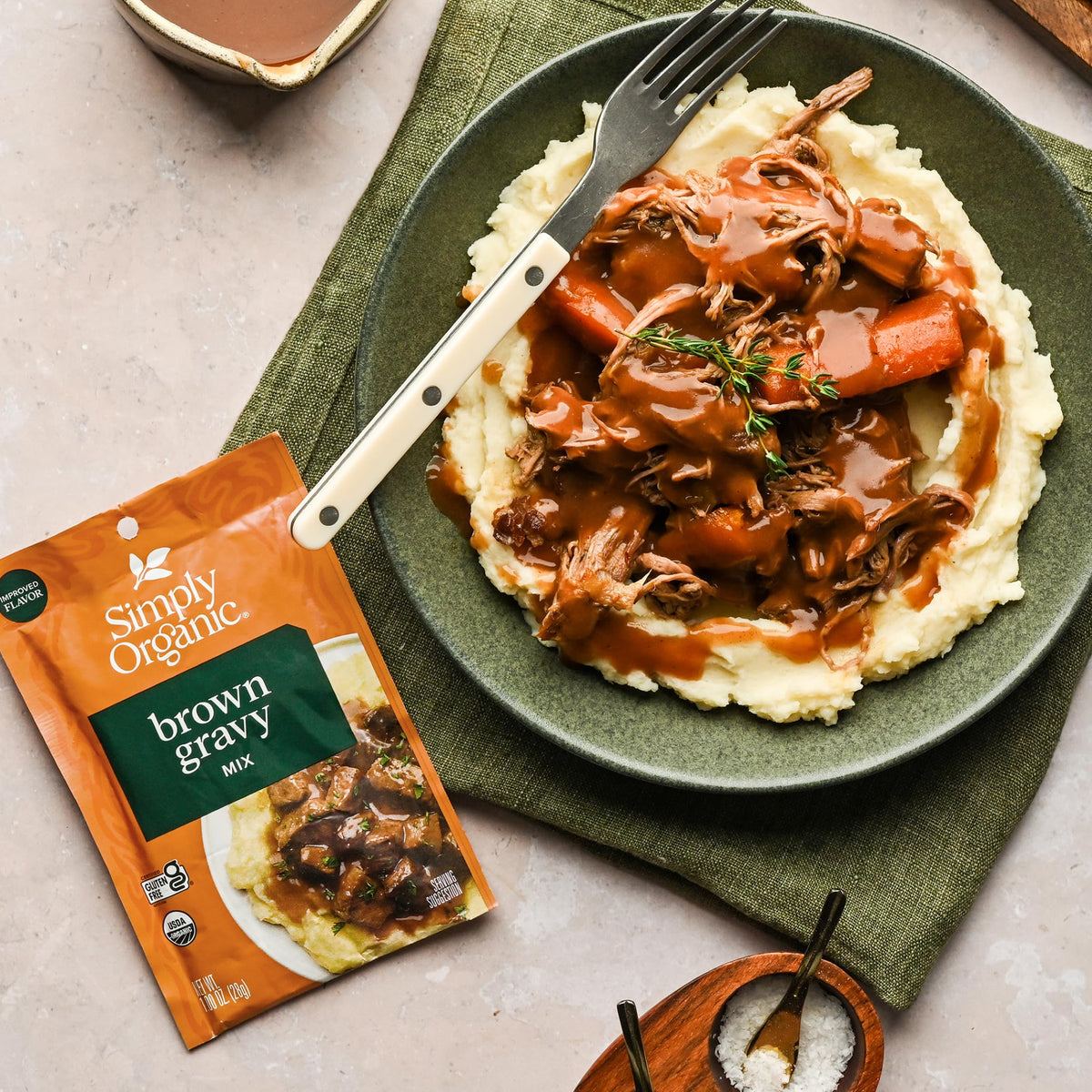 12-pack box of Simply Organic Brown Gravy Mix on store shelf.