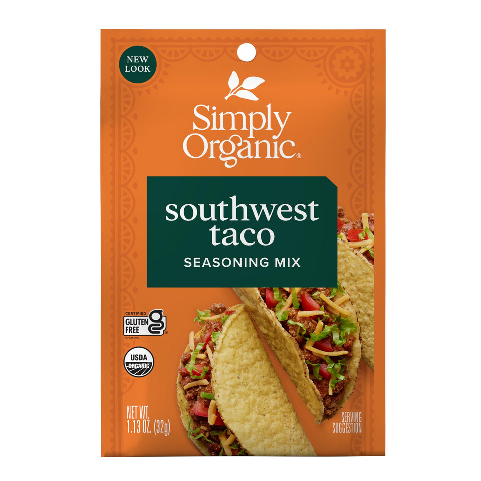 Simply Organic Southwest Taco Seasoning bottle pouring over sizzling tacos for bold flavor.