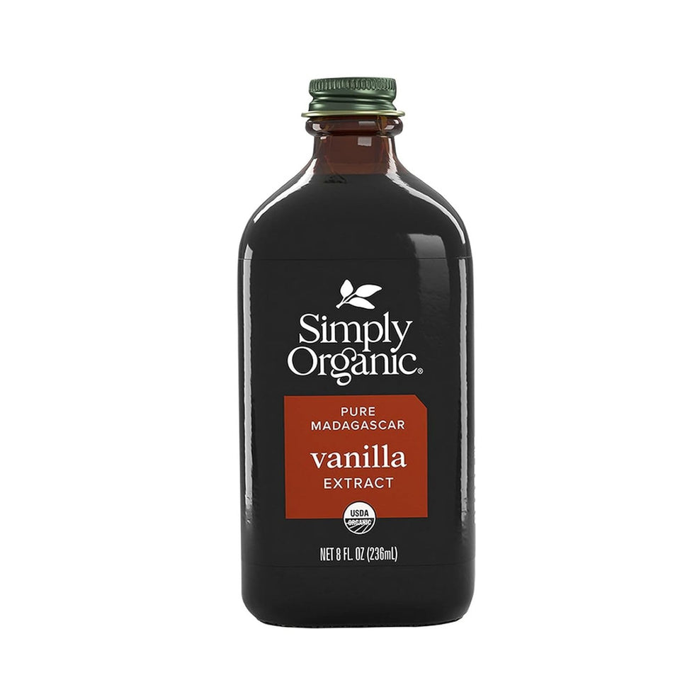 Simply Organic Vanilla Extract bottle pour showcases rich vanilla aroma for desserts
