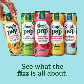 Pour of Simply POP Citrus Punch into glass reveals citrus fizz