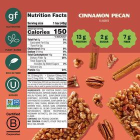 A hand holding Simply Protein Cinnamon Pecan Crispy Bar for a quick, protein-rich snack