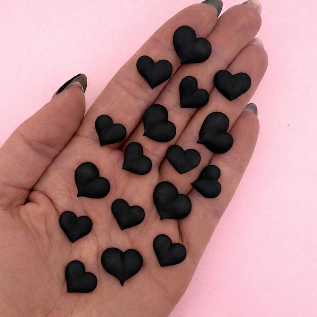 Simply Sucré Black Icing Hearts on a frosted cake add edible elegance