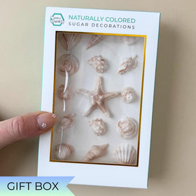 Simply Sucré seashell toppers add delicate texture to cupcakes and cookies.