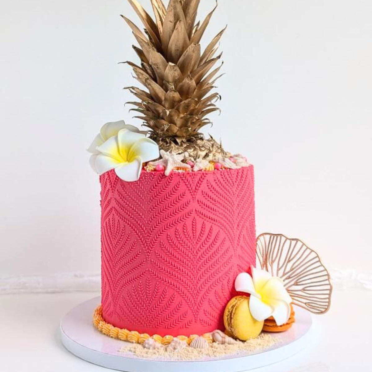 Simply Sucré starfish edible decorations enhance beach-themed desserts with subtle color.