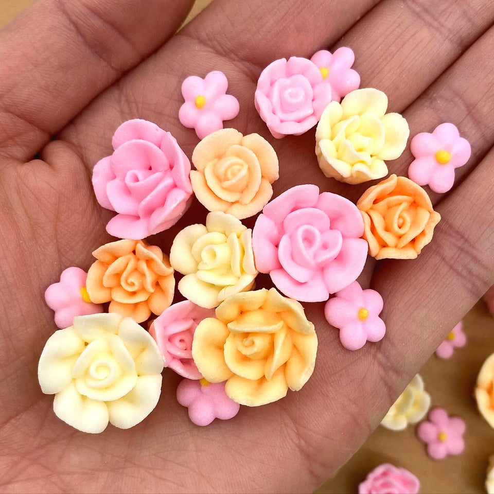 Simply Sucré tea party icing flowers in pink and ivory for cake decoration.