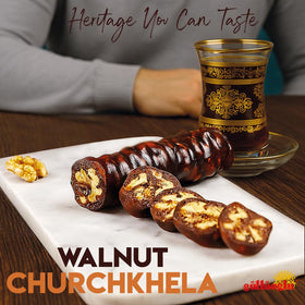 Gulluoglu Walnut Churchkhela slice on plate, ideal with cheese or tea.