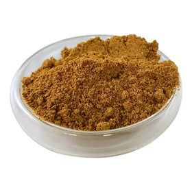 Pouring SING KUNG Madras curry powder for quick curries.