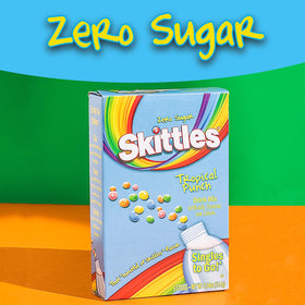 Glass with ice shows vibrant color from Skittles Tropical Punch.