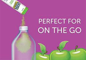 Prepared green apple drink in a glass highlighting bold flavor and clarity
