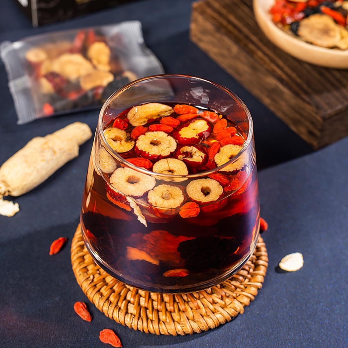 SIRDIKA Serving mulberries and goji berries as toppings after brew.