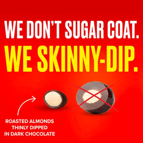 SkinnyDipped almonds on a store shelf emphasizing premium quality.